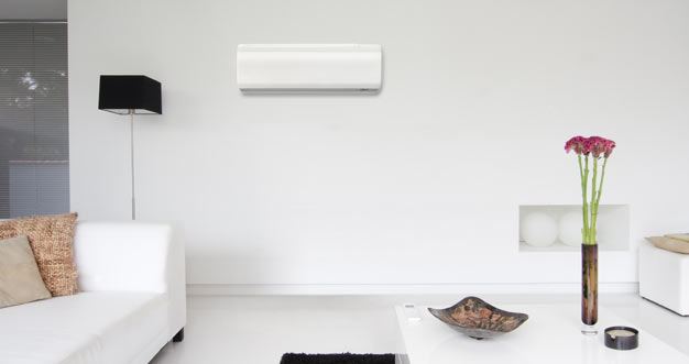 Heat pump high wall unit installed in a lounge